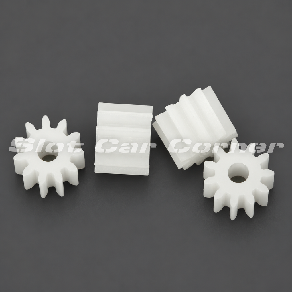 Four Scaleauto SC-1011 white 11-tooth polyamide pinions, front and side views on a dark gray background
