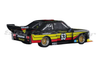 Sideways SW76 Ford Escort MKII Zakspeed No. 53, rear three-quarter view on white background